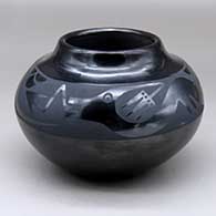 Click for a larger view A black on black jar decorated with an avanyu and geometric design around the shoulder
 by Santana Martinez of San Ildefonso