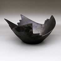 An open black, micaceous Stairway to Heaven bowl with fire clouds
 by Angie Yazzie of Taos