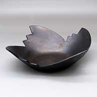 A micaceous black sculptural piece with a kiva step rim
 by Angie Yazzie of Taos