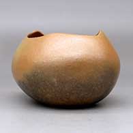 A golden micaceous pot with an organic opening and fire clouds, click or tap to see a larger version