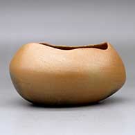 A golden micaceous pot with an organic opening and fire clouds, click or tap to see a larger version