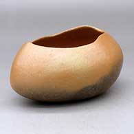 A golden micaceous pot with an organic opening and fire clouds
 by Glenn Gomez of Taos
