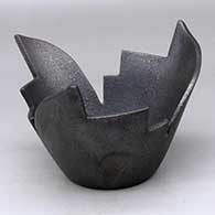A stylized micaceous black prayer bowl
 by Angie Yazzie of Taos