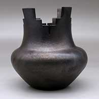 A black micaceous prayer jar with fire clouds, click or tap to see a larger version
