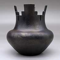 A black micaceous prayer jar with fire clouds, click or tap to see a larger version