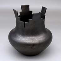 A black micaceous prayer jar with fire clouds
 by Angie Yazzie of Taos