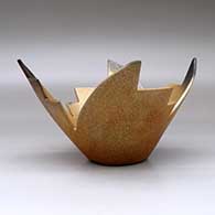 A stylized golden micaceous prayer bowl decorated with fire clouds, click or tap to see a larger version