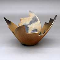 A stylized golden micaceous prayer bowl decorated with fire clouds
 by Angie Yazzie of Taos