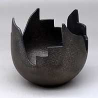 A micaceous black sculptural piece with four kiva step and geometric cut sides
 by Angie Yazzie of Taos