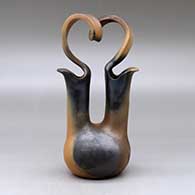 A golden micaceous wedding vase with a looped bridge and fire clouds, click or tap to see a larger version