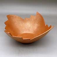 An open golden micaceous bowl with a four sided kiva step cut rim
 by Angie Yazzie of Taos