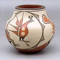 A small polychrome jar decorated with a four panel roadrunner, sunflower, rainbird and geometric design
 by Marcellus Medina of Zia