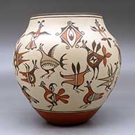 A polychrome jar decorated with images of birds from throughout Zia pottery history, click or tap to see a larger version