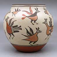 A polychrome jar decorated with images of roadrunners from throughout Zia pottery history, click or tap to see a larger version