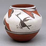A small polychrome jar decorated with a four panel roadrunner, cloud and geometric design
 by Gloria Gachupin of Zia