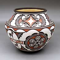 A polychrome jar with a flared rim and decorated with a six-panel rosette, deer-in-his-house, rainbird and geometric design
 by Carlos Laate of Zuni