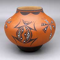 A polychrome jar decorated with a dragonfly, frog and geometric design
 by Anderson Jamie Peynetsa of Zuni