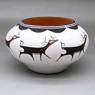 A polychrome jar decorated with a band of deer-with-heart-line and geometric design
 by Anderson Peynetsa of Zuni