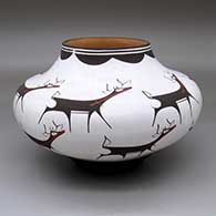 A polychrome jar decorated with a deer-with-heart-line and geometric design
 by Anderson Peynetsa of Zuni