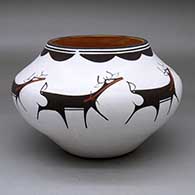 A polychrome jar decorated with a band of deer-with-heart-line and geometric design
 by Anderson Peynetsa of Zuni