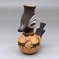 A polychrome duck pot decorated with a deer-with-heart-line and geometric design
 by Anderson Peynetsa of Zuni