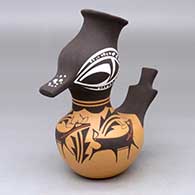 A polychrome duck pot decorated with a deer-with-heart-line, mountains, forest and geometric design
 by Anderson Peynetsa of Zuni