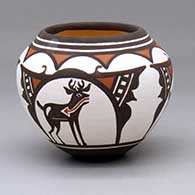 A small polychrome jar decorated with a three-panel geometric design
 by Carlos Laate of Zuni