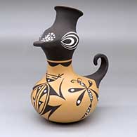 A polychrome duck effigy jar decorated with a dragonfly, frog and geometric design
 by Anderson Jamie Peynetsa of Zuni