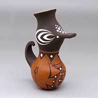 A small polychrome duck effigy pot decorated with a frog, tadpole and geometric design
 by Anderson Jamie Peynetsa of Zuni