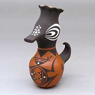 A small polychrome duck effigy pot with a pie crust rim and decorated with a frog, tadpole and geometric design
 by Anderson Jamie Peynetsa of Zuni