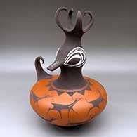 A polychrome duck pot with a feathered crown and decorated with a deer-with-heart-line ad geometric design 
 by Anderson Peynetsa of Zuni