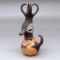 A small polychrome duck pot with a feathered crown and a deer-with-heart-line and geometric design
 by Anderson Peynetsa of Zuni