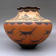 A large polychrome jar with a pie crust rim and decorated with a deer-with-heart-line and geometric design, click or tap to see a larger version