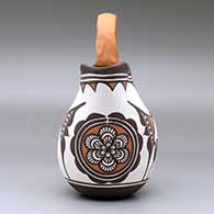 A polychrome wedding vase decorated with a deer-in-his-house, rosette and geometric design, click or tap to see a larger version