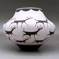 A polychrome jar decorated with a deer-with-heart-line and geometric design, click or tap to see a larger version