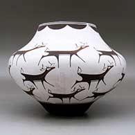 A polychrome jar decorated with a deer-with-heart-line and geometric design, click or tap to see a larger version