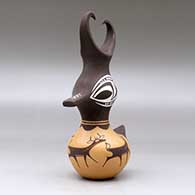 A small polychrome, feather-crested duck pot decorated with a deer-with-heart-line and geometric design, click or tap to see a larger version