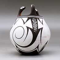 A polychrome jar decorated with three lizard head appliques and a lizard and geometric design, click or tap to see a larger version