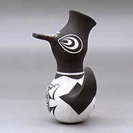 A small polychrome, crowned duck pot decorated with a frog, tadpole and geometric design, click or tap to see a larger version