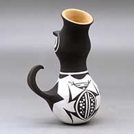 A small polychrome, crowned duck pot decorated with a frog, tadpole and geometric design, click or tap to see a larger version