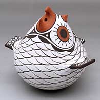 A polychrome owl effigy pot decorated with a bird element and geometric design
 by Anderson Jamie Peynetsa of Zuni