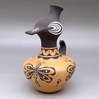 A polychrome duck effigy pot decorated with a dragonfly, tadpole and geometric design
 by Anderson Jamie Peynetsa of Zuni