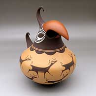 Click for a larger view A polychrome parrot effigy jar decorated with a deer-with-heart-line and geometric design
by Anderson Peynetsa of Zuni