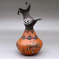 A polychrome crested duck pot decorated with a dragonfly, tadpole and geometric design, click or tap to see a larger version