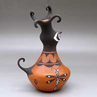 A polychrome crested duck pot decorated with a dragonfly, tadpole and geometric design, click or tap to see a larger version