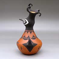 A polychrome crested duck pot decorated with a dragonfly, tadpole and geometric design, click or tap to see a larger version