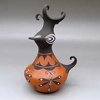 A polychrome crested duck pot decorated with a dragonfly, tadpole and geometric design
 by Anderson Jamie Peynetsa of Zuni