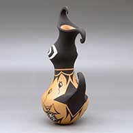 A polychrome crested duck pot decorated with a frog, tadpole and geometric design, click or tap to see a larger version