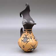 A polychrome crested duck pot decorated with a frog, tadpole and geometric design, click or tap to see a larger version