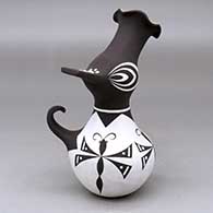 A polychrome crowned duck pot decorated with a frog, dragonfly and geometric design
 by Anderson Jamie Peynetsa of Zuni